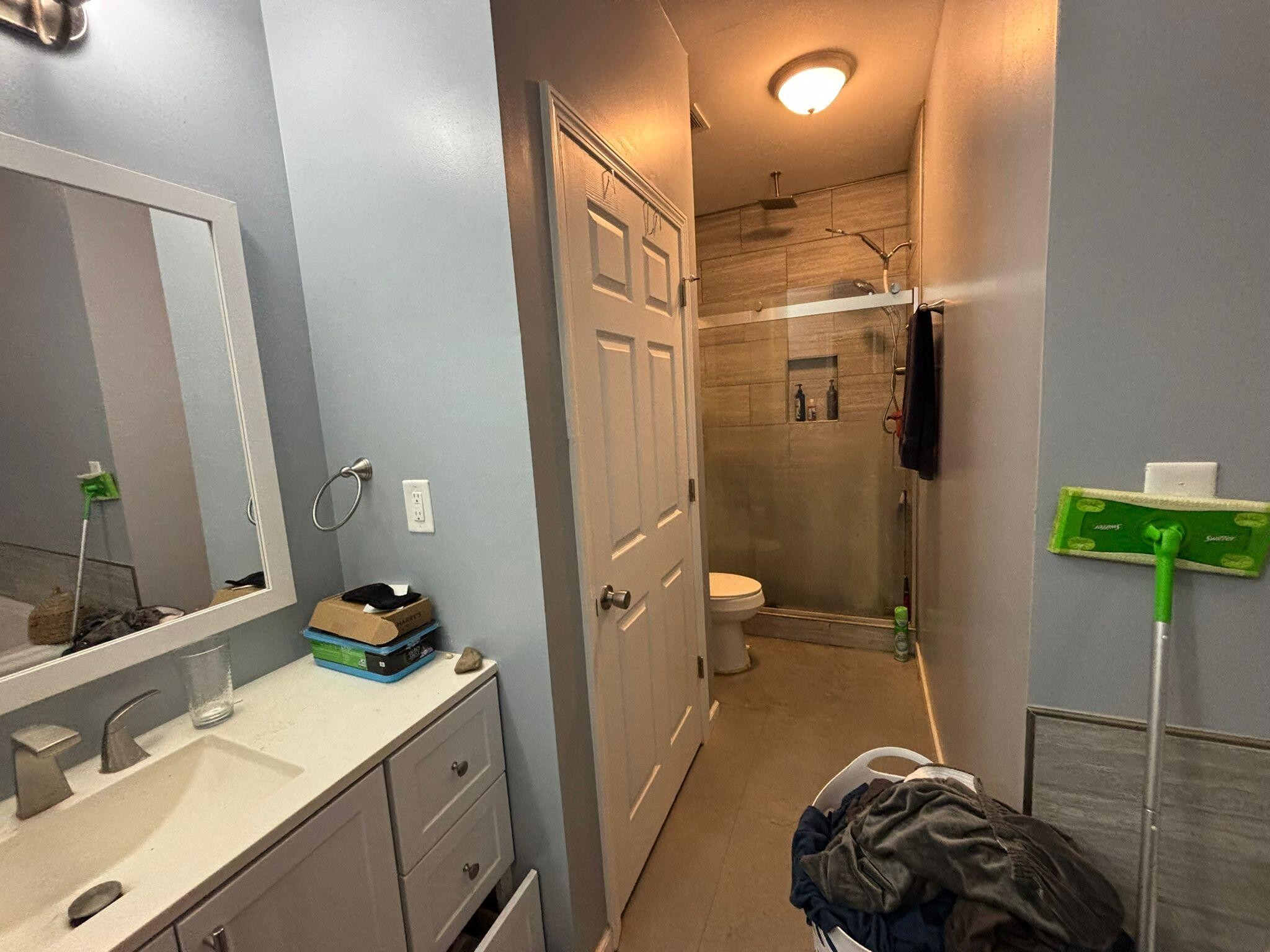 1919 Campground Road Drummonds, TN 38023 - Photo 27 of 47 a bathroom with a sink a toilet and shower