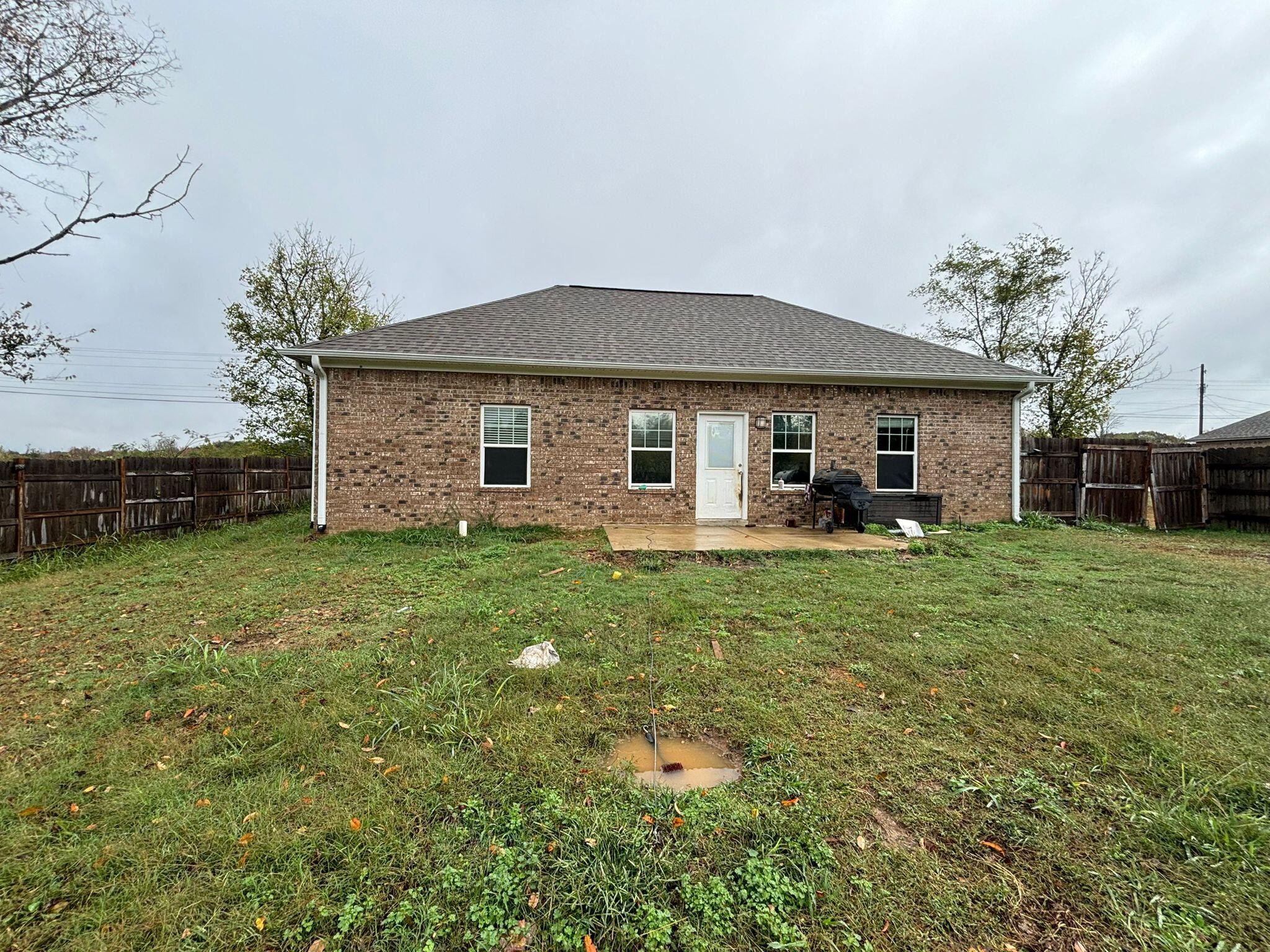 1919 Campground Road Drummonds, TN 38023 - Photo 44 of 47 a front view of a house with a garden and trees