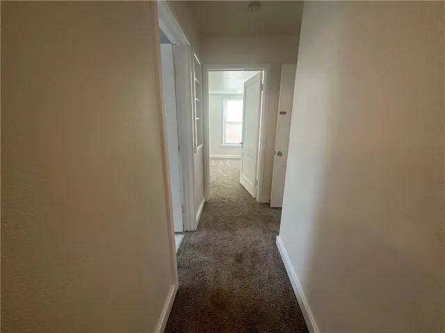 a bathroom with a sink a toilet and a window