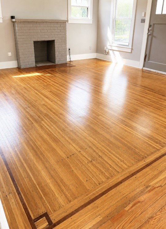 4530 Walker Street Houston, TX 77023 - Photo 9 of 17 a view of empty room with wooden floor and fireplace
