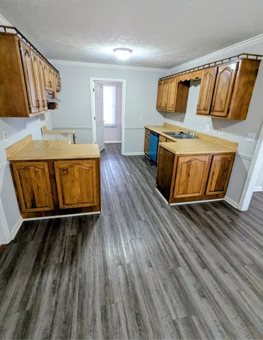 a living room with a fireplace wooden floor and furniture