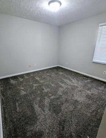 a view of a room that has a window in it