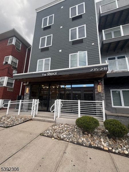 241 Ridge Road North Arlington, NJ 07031 - Photo 2 of 14 a front view of a house with a garage