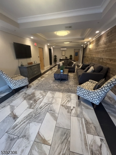 241 Ridge Road North Arlington, NJ 07031 - Photo 4 of 14 a living room with furniture and a flat screen tv