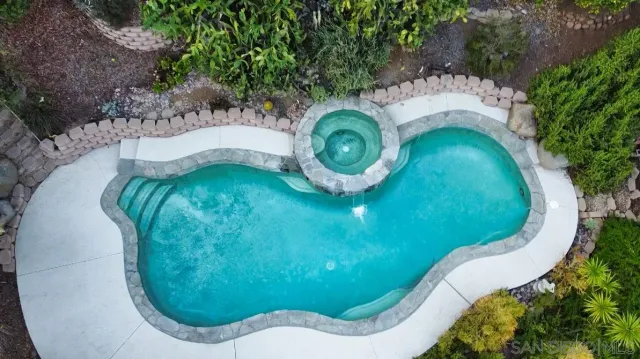 an aerial view of a swimming pool