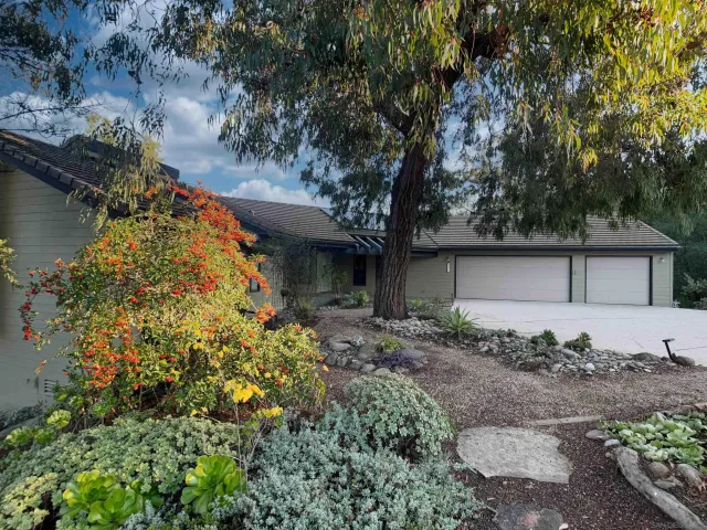 a backyard of a house with lots of green space