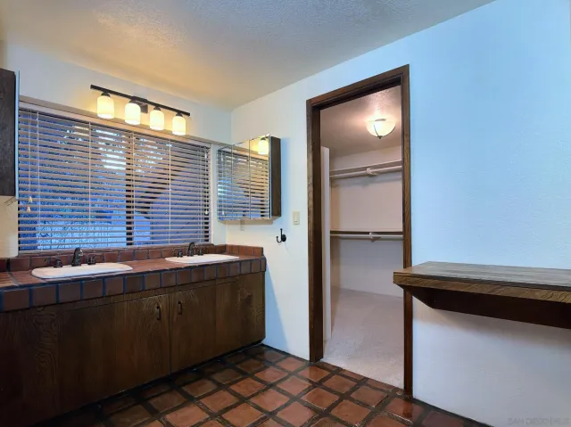 a bathroom with a sink and a shower