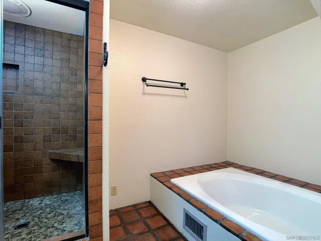 a bathroom with a sink and a shower