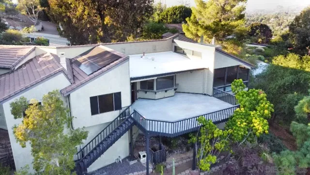 a terrace of a house with table and chairs