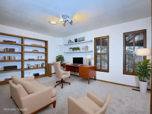 a living room with furniture fireplace and lamp