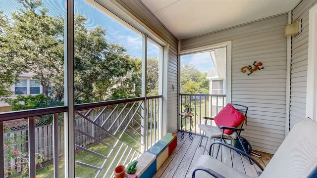 an empty room with a empty space and windows