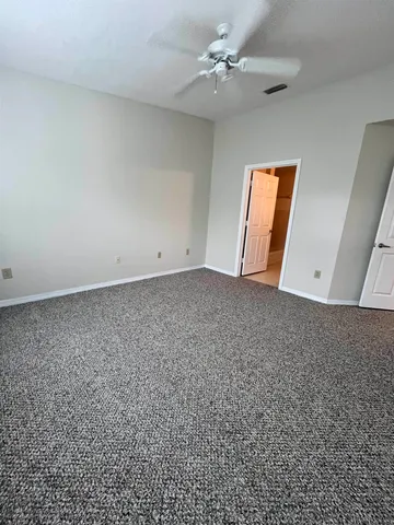 a view of a house with yard and sitting area