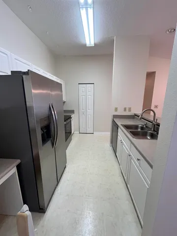 a view of a balcony with furniture and wooden floor