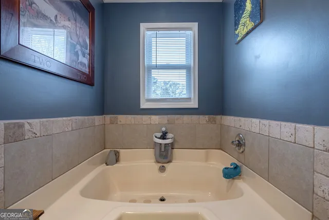 a bed room with a bed and a chandelier