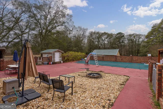 a view of a wooden house with a yard