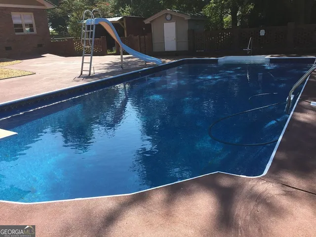 a view of a car is parked in front of a house