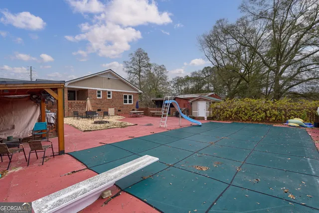 an aerial view of a house with a yard