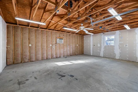 a yellow house with trees in front of it
