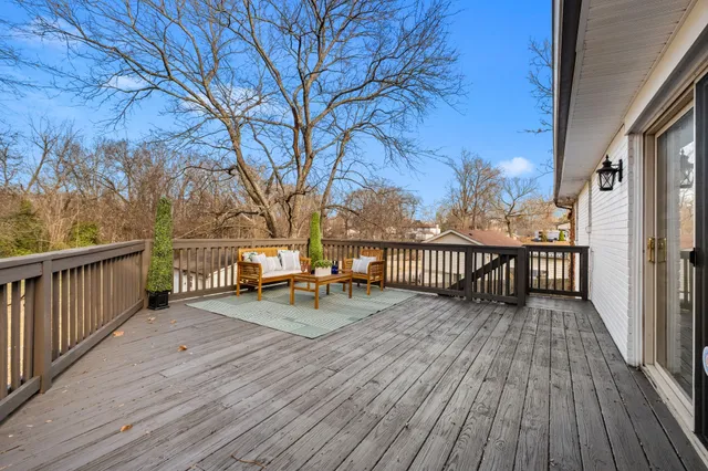 a view of deck with wooden floor and outdoor seating