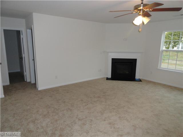 1321 Sharp Ridge Road Greensboro, NC 27406 - Photo 5 of 6 Den/Family/Great Room. Large family room with fireplace. Behind it is an office and half bath.