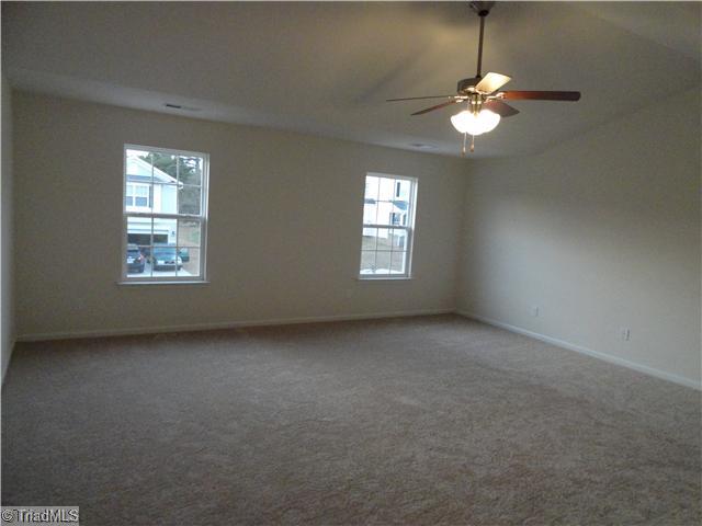 1321 Sharp Ridge Road Greensboro, NC 27406 - Photo 6 of 6 Master Bedroom. This home has an enormous master bedroom with cathedral ceiling. The adjoining bath has garden tub, separate shower, and double-bowl vanity.