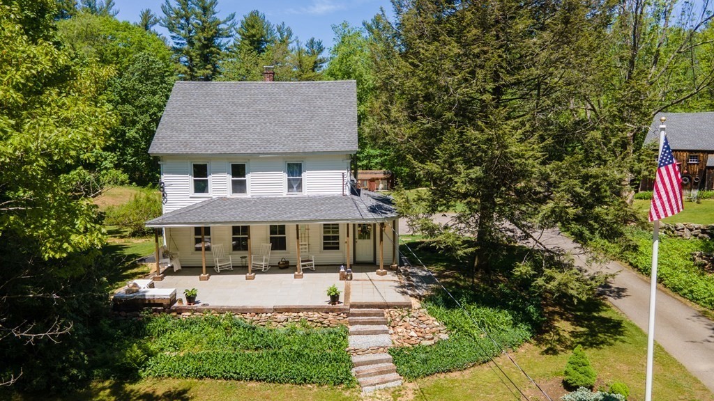 1423 Piper Road Ashby, MA 01431 - Photo 1 of 42 a front view of a house with a yard