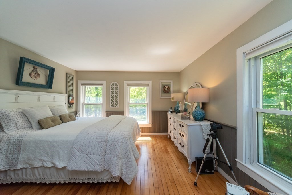 1423 Piper Road Ashby, MA 01431 - Photo 22 of 42 a bed room with a bed and a wooden floor