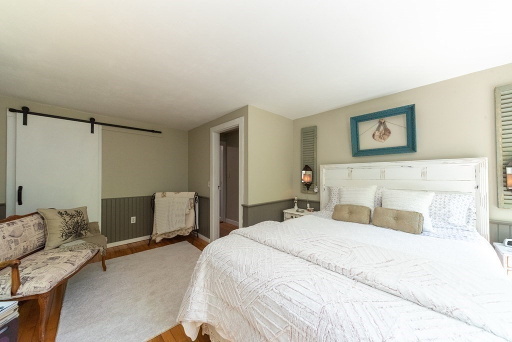 1423 Piper Road Ashby, MA 01431 - Photo 23 of 42 a bedroom with a bed and couch