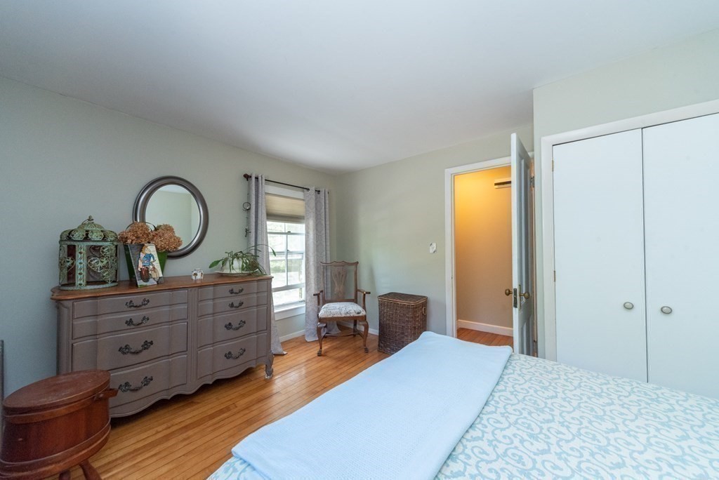 1423 Piper Road Ashby, MA 01431 - Photo 24 of 42 a bed room with a bed and a dresser