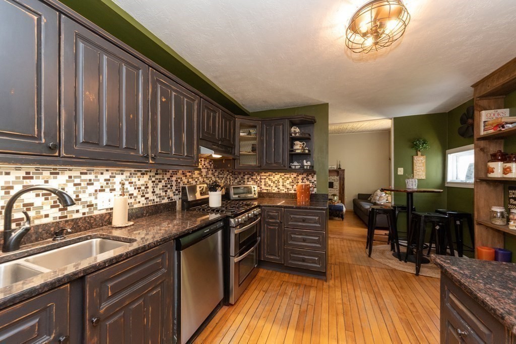 1423 Piper Road Ashby, MA 01431 - Photo 6 of 42 a kitchen with granite countertop a sink dishwasher stove and cabinets