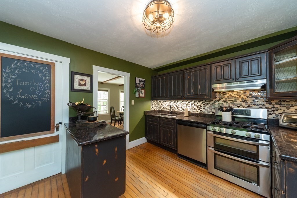1423 Piper Road Ashby, MA 01431 - Photo 7 of 42 a kitchen with stainless steel appliances granite countertop a stove and a refrigerator