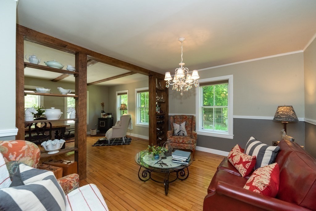 1423 Piper Road Ashby, MA 01431 - Photo 9 of 42 a living room with furniture chandelier and a window