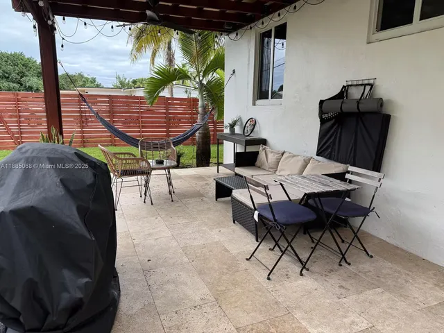 a view of a chairs and tables in the patio
