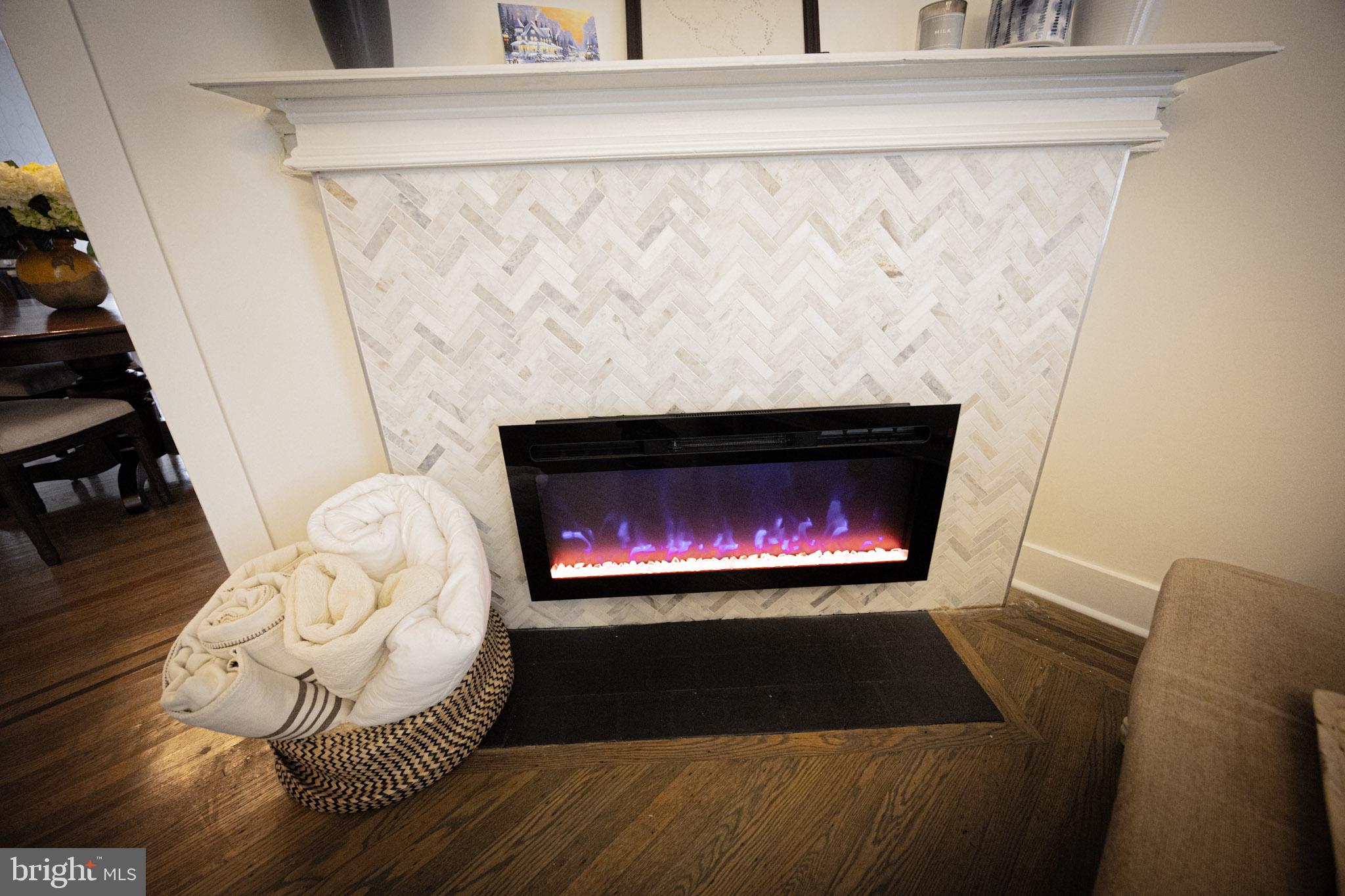 411 Vernon Road Philadelphia, PA 19119 - Photo 12 of 49 a living room with furniture and a fireplace