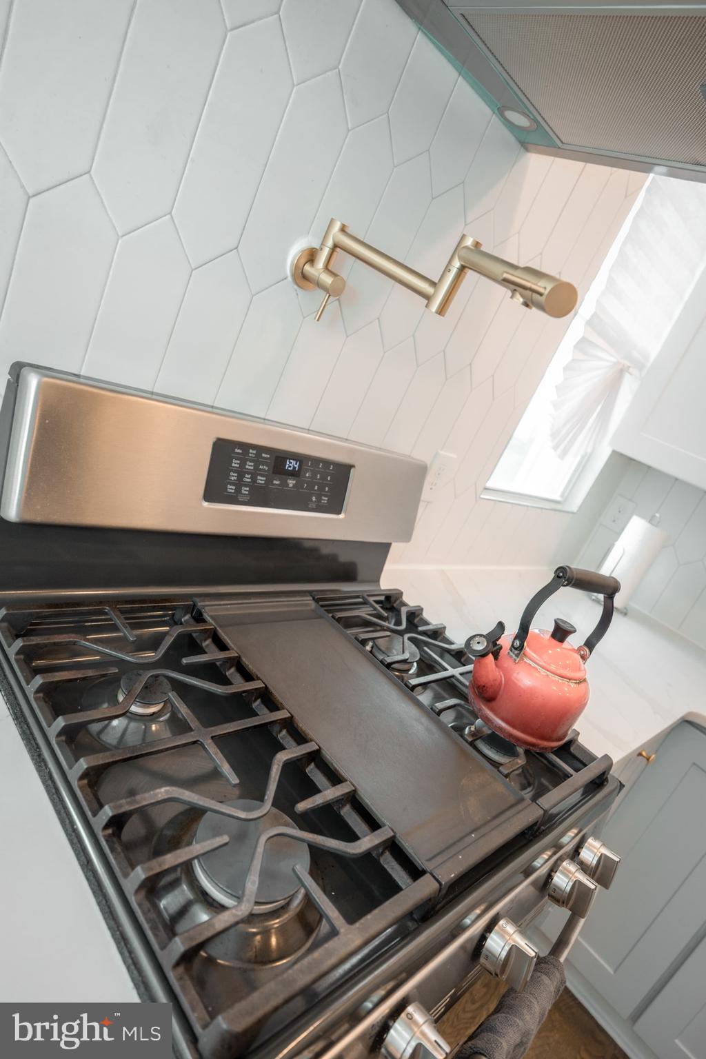 411 Vernon Road Philadelphia, PA 19119 - Photo 27 of 49 a stove top oven sitting on a shelf