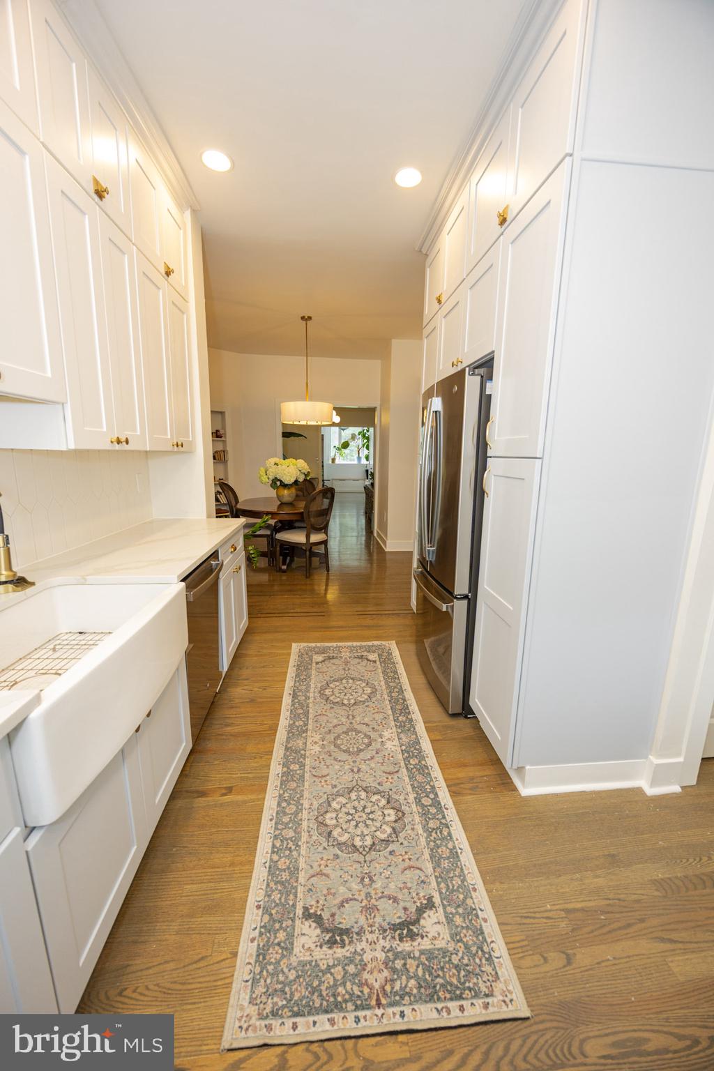 411 Vernon Road Philadelphia, PA 19119 - Photo 28 of 49 a large kitchen with stainless steel appliances granite countertop a refrigerator oven stove a sink and dishwasher