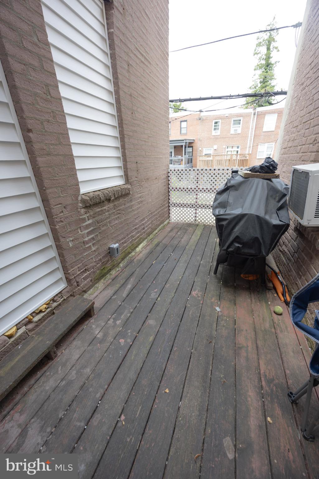 411 Vernon Road Philadelphia, PA 19119 - Photo 29 of 49 a balcony with wooden floor table and chairs