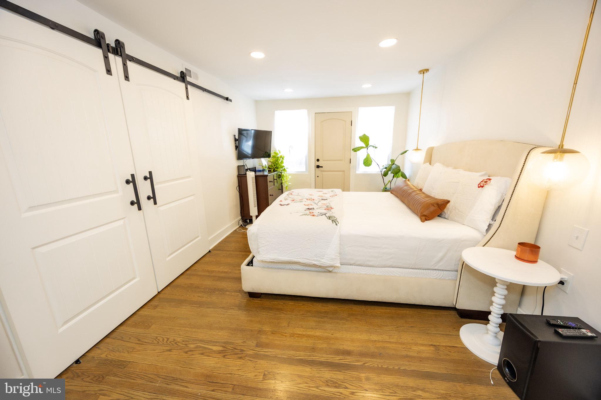 411 Vernon Road Philadelphia, PA 19119 - Photo 32 of 49 a bedroom with a bed and a table