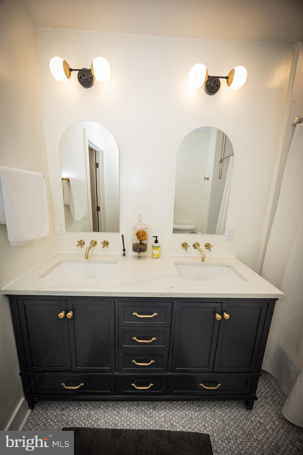 411 Vernon Road Philadelphia, PA 19119 - Photo 35 of 49 a bathroom with a sink and a mirror