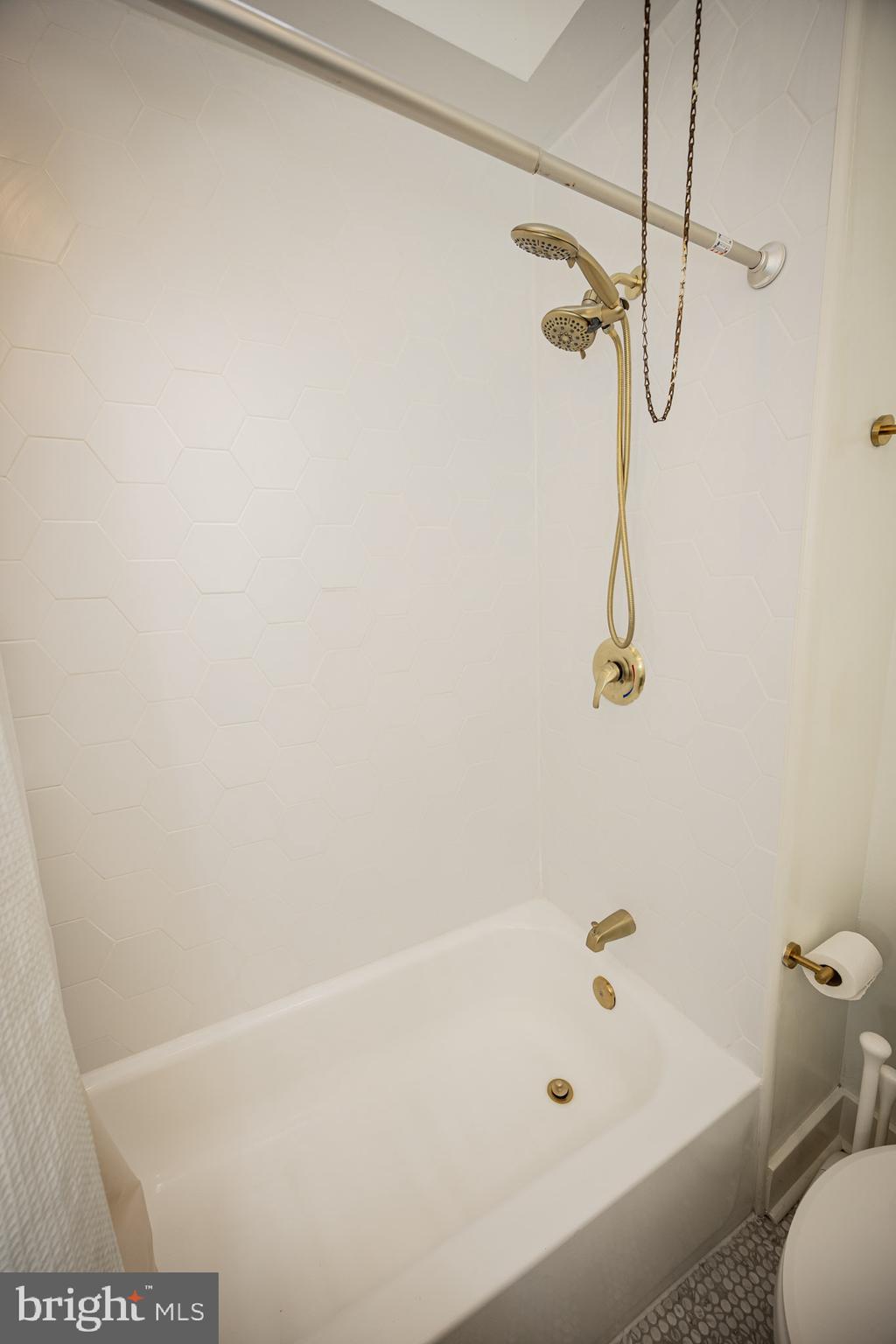 411 Vernon Road Philadelphia, PA 19119 - Photo 37 of 49 a bathroom with a bath tub with a shower