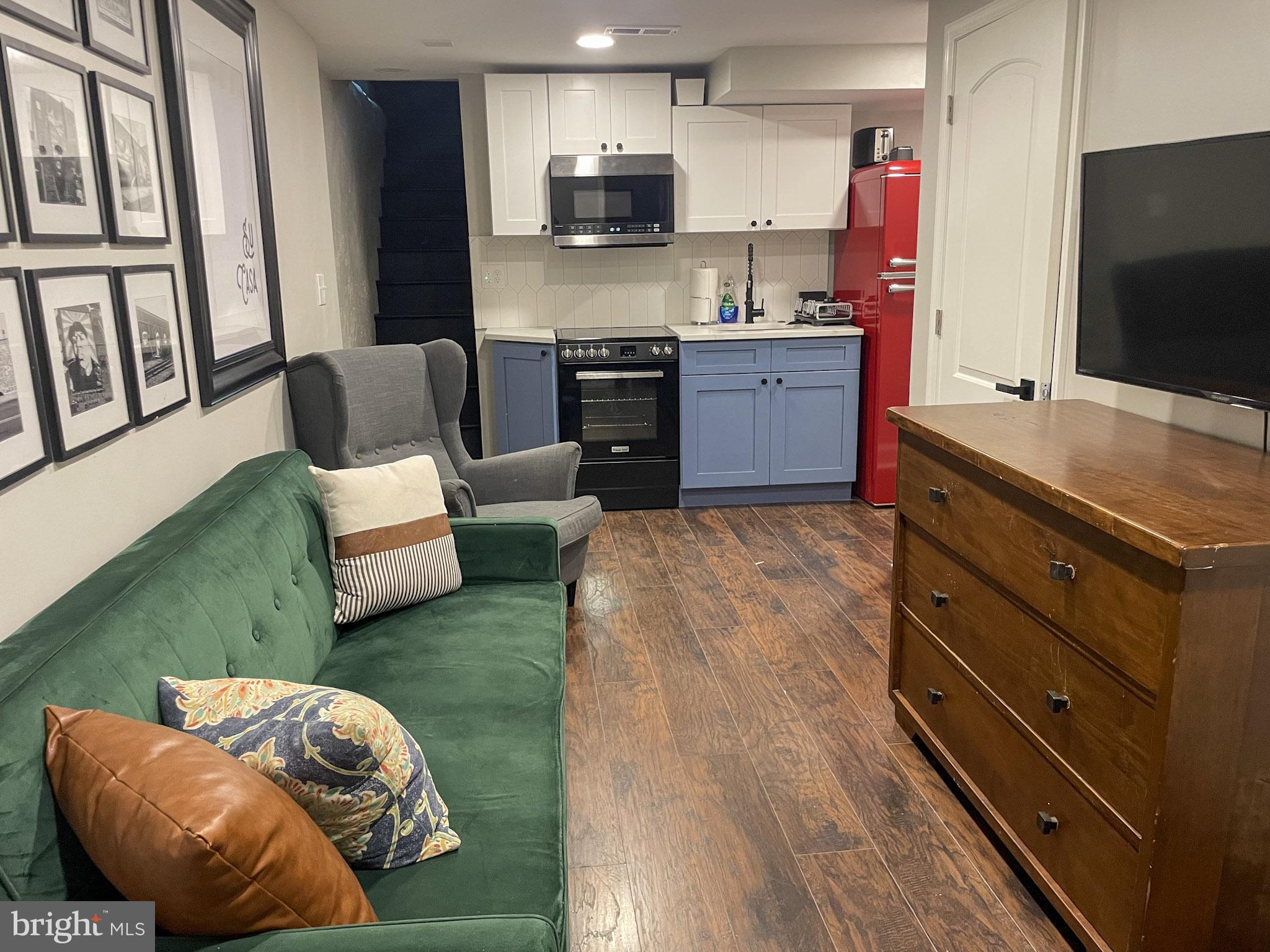 411 Vernon Road Philadelphia, PA 19119 - Photo 41 of 49 a kitchen with stainless steel appliances kitchen island granite countertop a refrigerator a stove and a sink with granite countertops