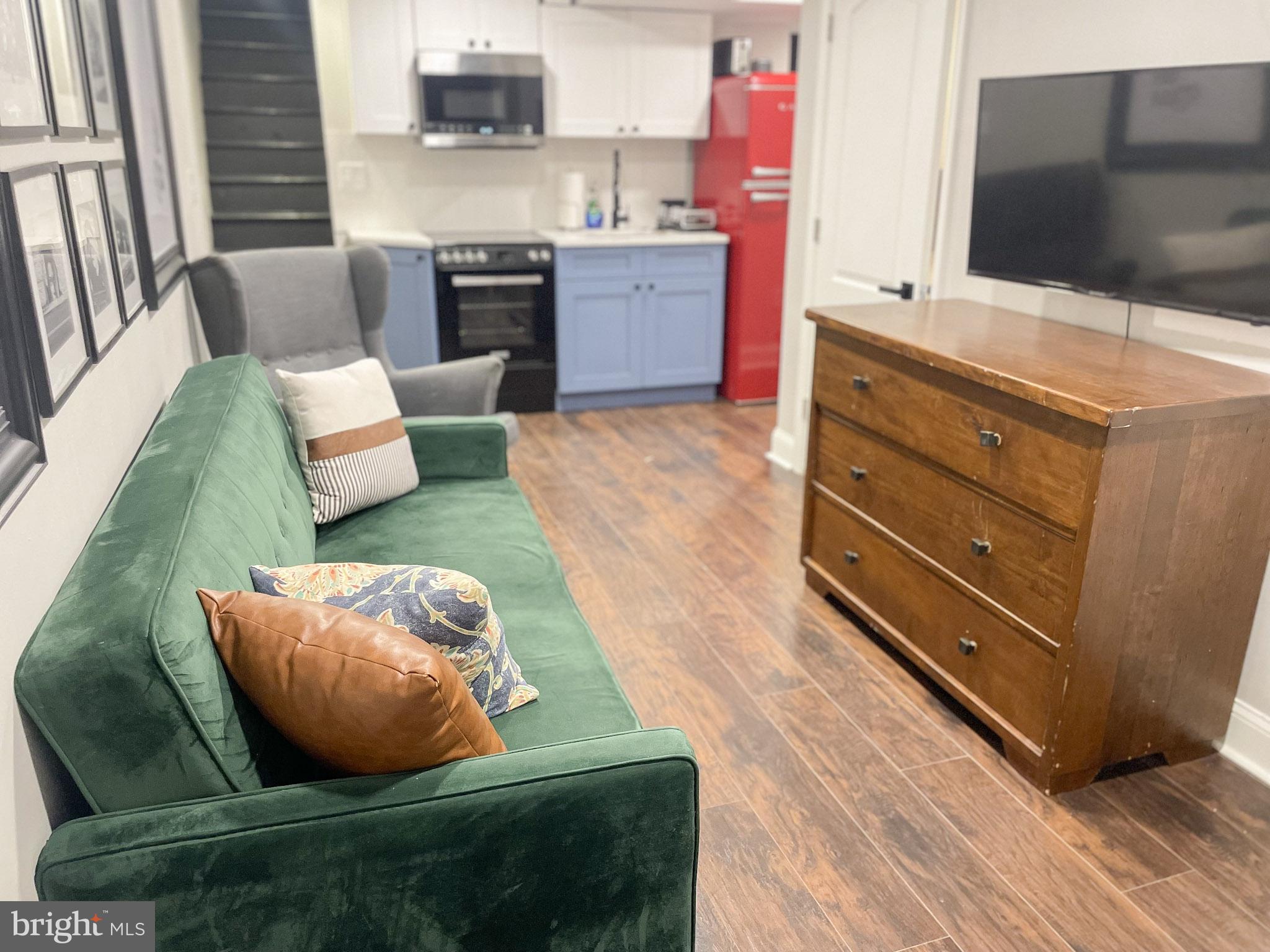 411 Vernon Road Philadelphia, PA 19119 - Photo 44 of 49 a living room with furniture and flat screen tv