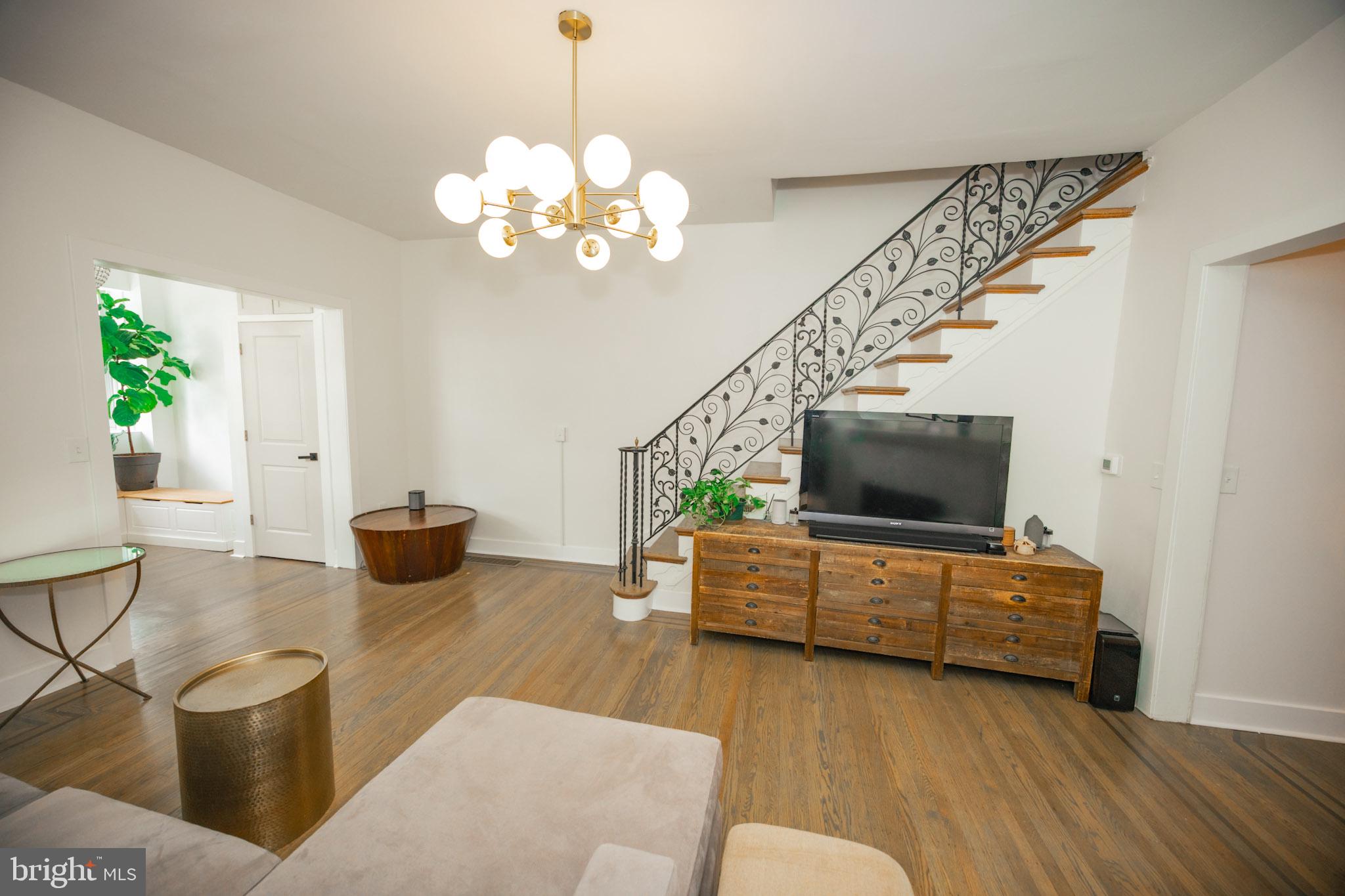 411 Vernon Road Philadelphia, PA 19119 - Photo 10 of 49 a living room with furniture and a flat screen tv
