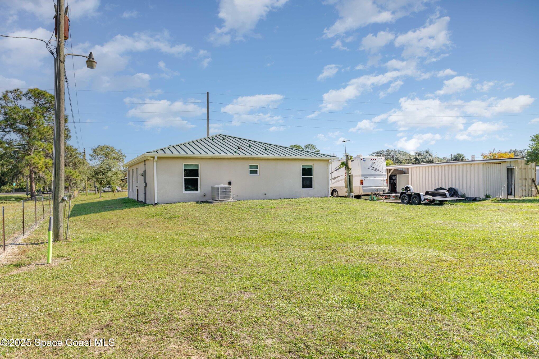 6786 U.S. Rte 1 Mims, FL 32754 - Photo 20 of 33 a front view of the house with a yard