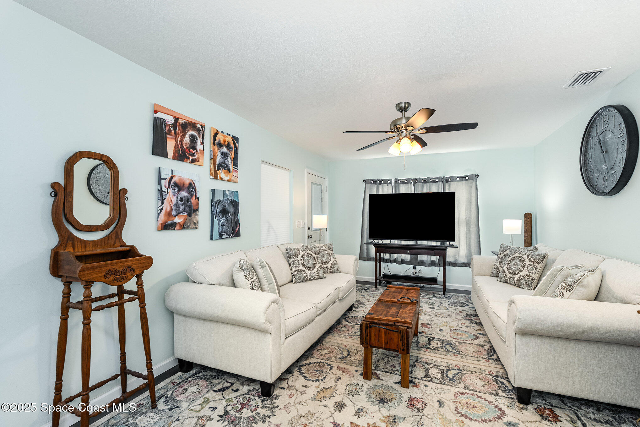 6786 U.S. Rte 1 Mims, FL 32754 - Photo 4 of 33 a living room with furniture a flat screen tv and a window