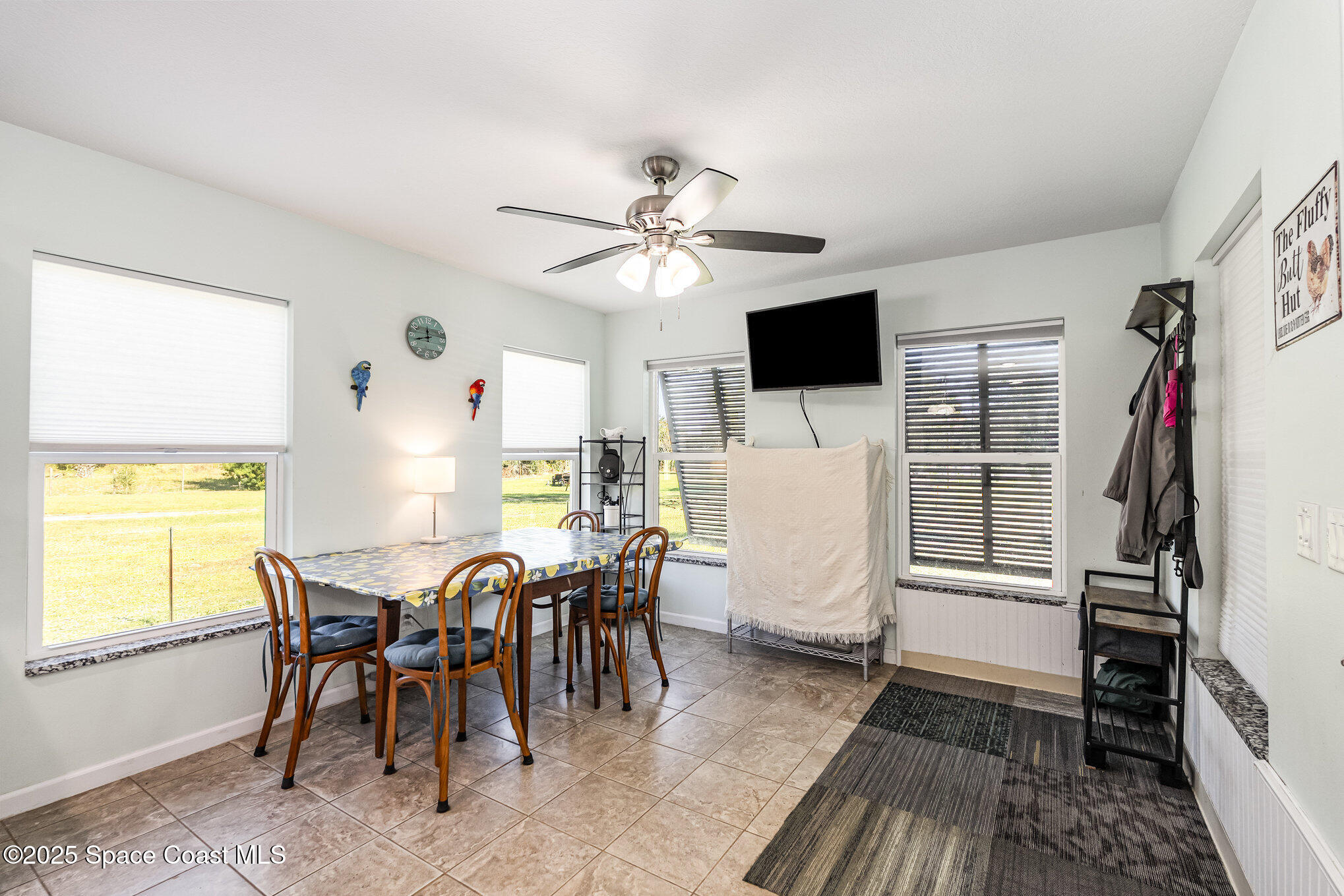 6786 U.S. Rte 1 Mims, FL 32754 - Photo 10 of 33 a view of a dining room with furniture window and wooden floor