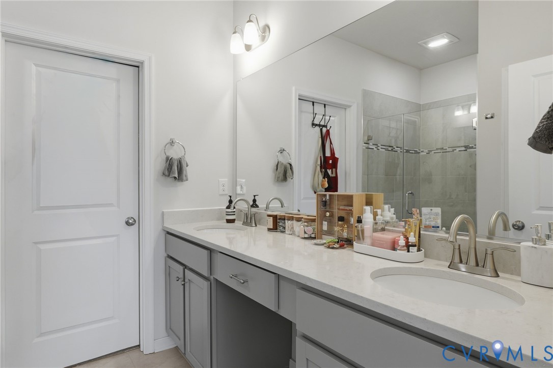 1900 Roseneath Road, Unit 4B Richmond, VA 23230 - Photo 14 of 44 a bathroom with double vanity sink and a mirror