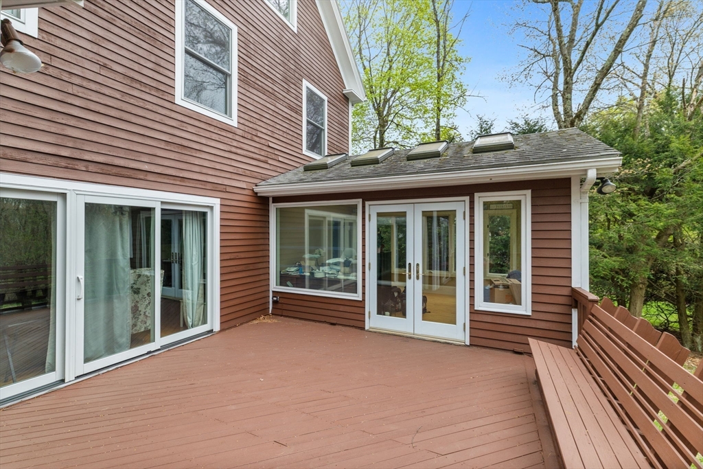 17 Wellesley Street Weston, MA 02493 - Photo 28 of 30 a view of house with a large window and wooden floor