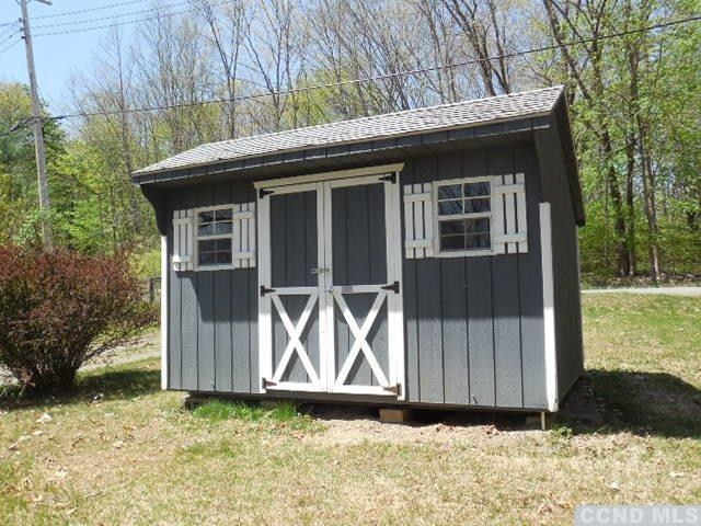 1010 Lakeview Road Copake, NY 12516 - Photo 4 of 10 a wooden door in front of a house