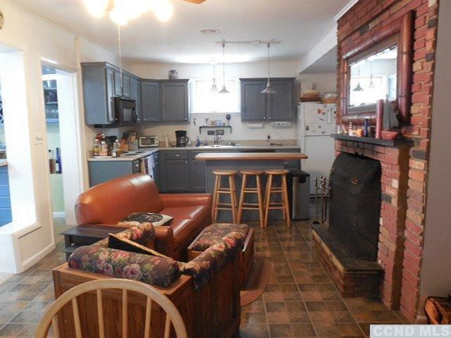 1010 Lakeview Road Copake, NY 12516 - Photo 6 of 10 a kitchen with a sink appliances cabinets and furniture